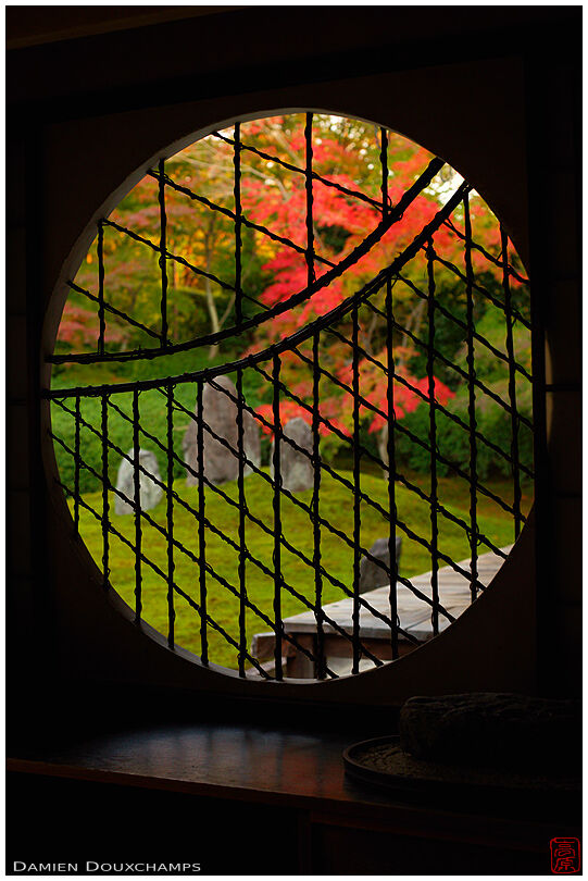 Round window on rock garden