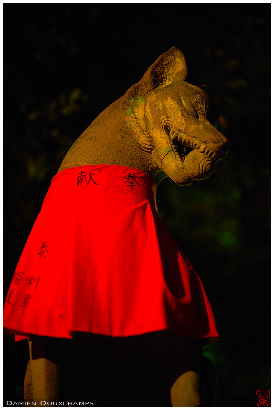 Fox statue with red cloth