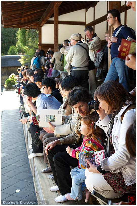 Tourists in Ryoan-ji temple, Kyoto, Japan