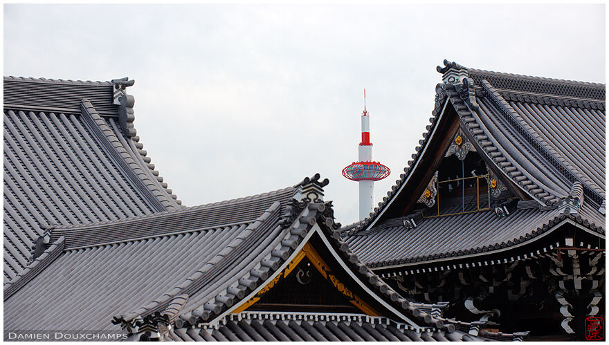 Traditional monochrome roofs and bright red modern tower, Nishi Honganji (西本願寺)