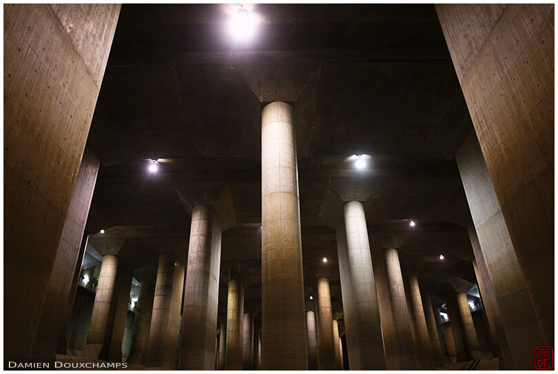 Massive concrete pillars in the underground water reservoir cathedral of the G-Cans system, Tokyo, Japan