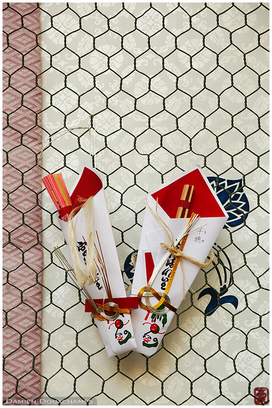 Votive offerings hung to shrine gate (Matsuno-taisha 松尾大社)