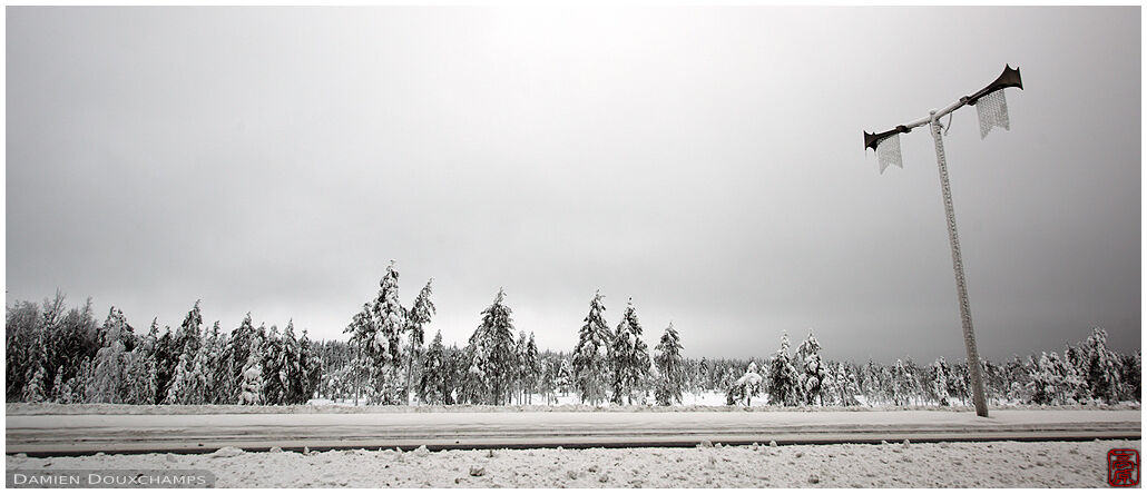 Desolate snow-covered road north of Rovaniemi