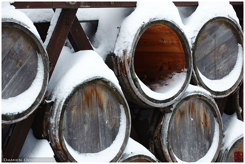 Snow covered old wine barrels