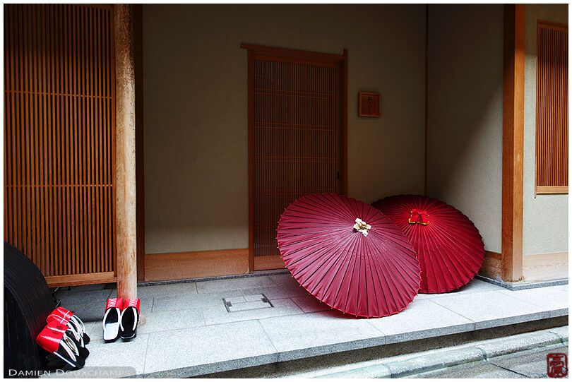 Traditional umbrellas and geisha footwear called geta in Gion