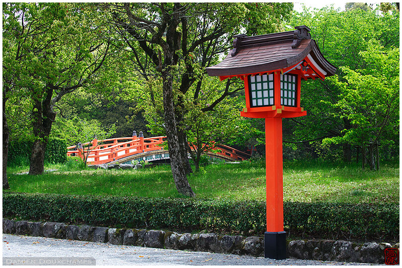 Orange lantern and bridge on Usa shrine grounds