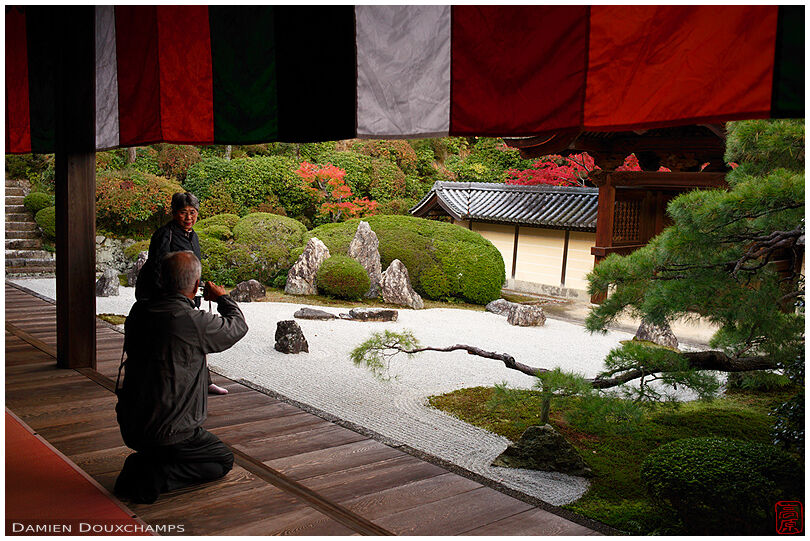 Visitors taking pictures in Komyo-ji temple garden