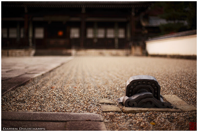 Old roof tile used as element of a large rock garden in Manpuku-ji temple, Kyoto, Japan