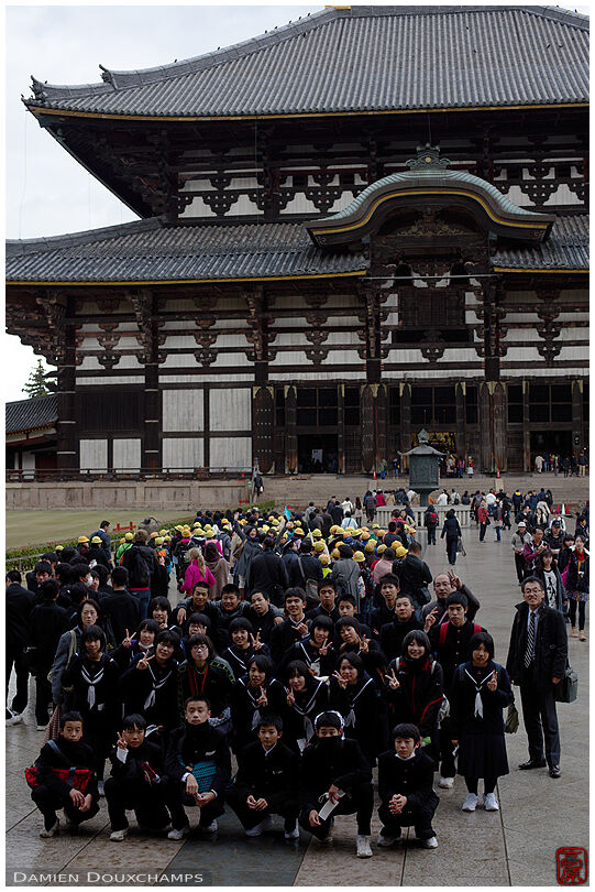 Student class posing for pictures in Todai-ji temple, Nara, Japan