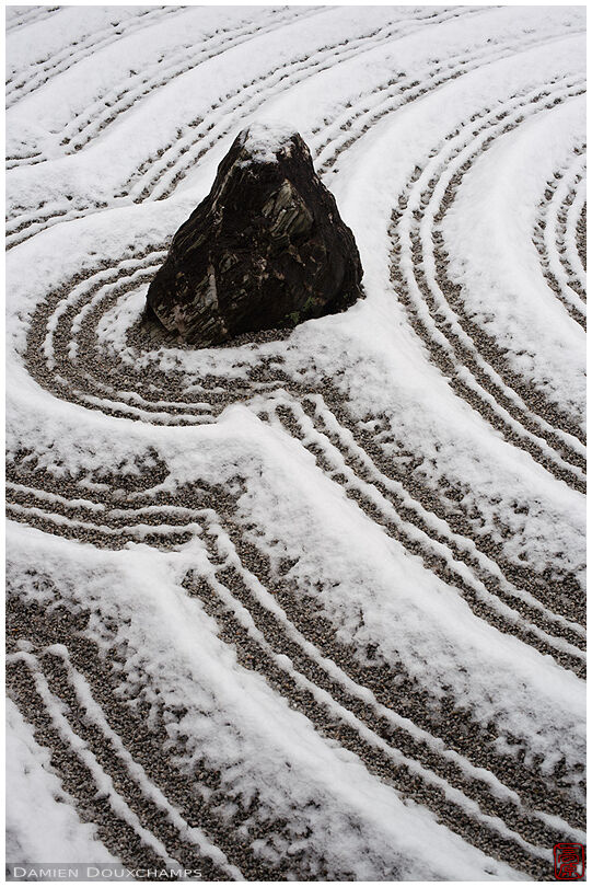 Light snow cover enhancing the sand patterns in the garden of Suiho-in temple, Kyoto, Japan