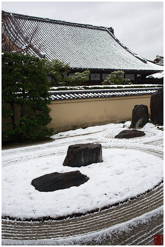 Light snow covering the patterns of the rock garden of Ryogen-in temple, Kyoto, Japan
