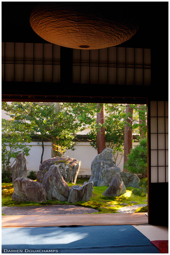 Room with large paper lamp and view on dry landscape garden by Shigemori Mirei, Kyoto, Japan
