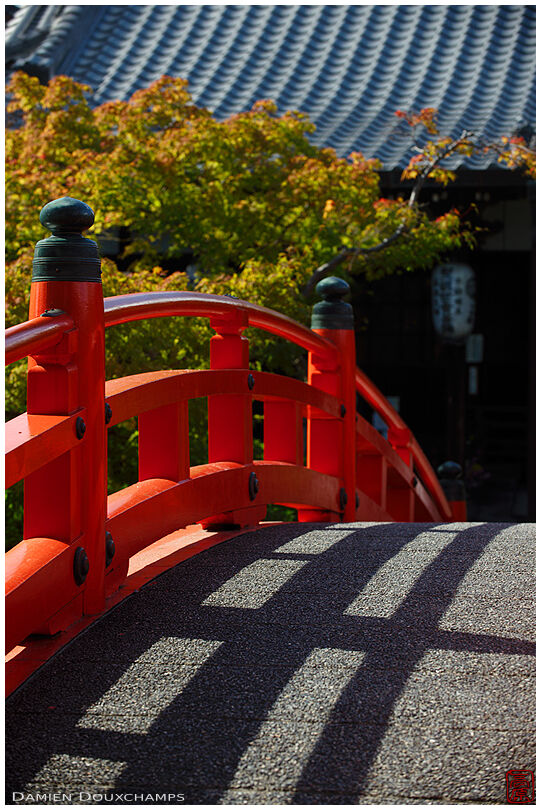 Red curved bridge detail, Shinsen-en garden, Kyoto, Japan