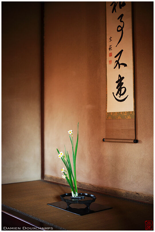 Ikebana and hanging scroll in the tonokoma of a tea room of Shodensanso, Kyoto, Japan