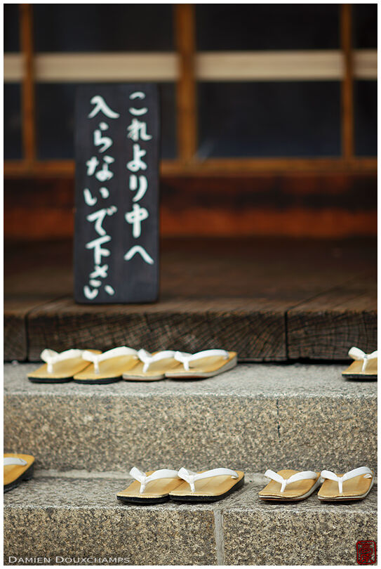 Traditional sandals and no entry sign, Sanjusangen-do temple, Kyoto, Japan
