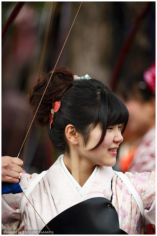 Young female archer during the annual toshiya competition in Sanjusangen-do temple, Kyoto, Japan