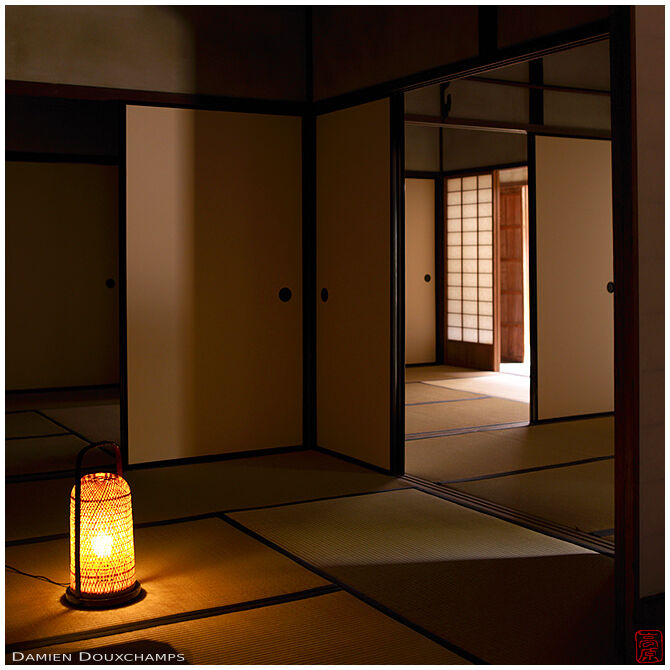 Lantern-lit typical Japanese architecture with tatami and fusuma sliding doors in the Iwakura hermitage, Kyoto, Japan