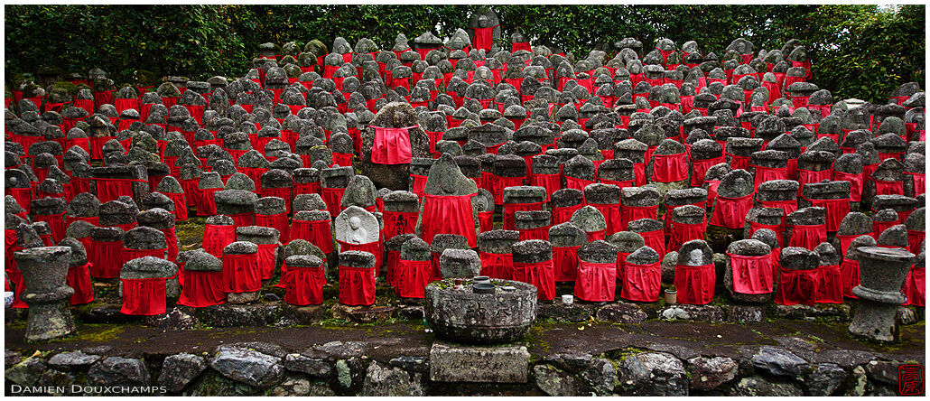 Large gathering of jizo statues with red bibs, Risho-in temple, Kyoto, Japan