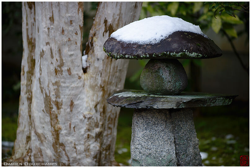 Stone lantern that is not a lantern with a little snow hat, Yotoku-in temple, Kyoto, Japan