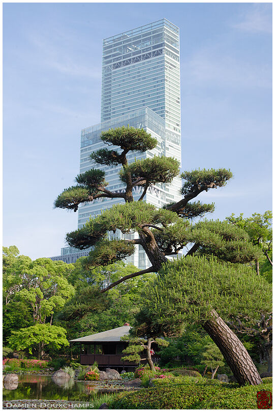 The Harukas tower overlooking the exquisite Keitaku-en gardens in Osaka, Japan
