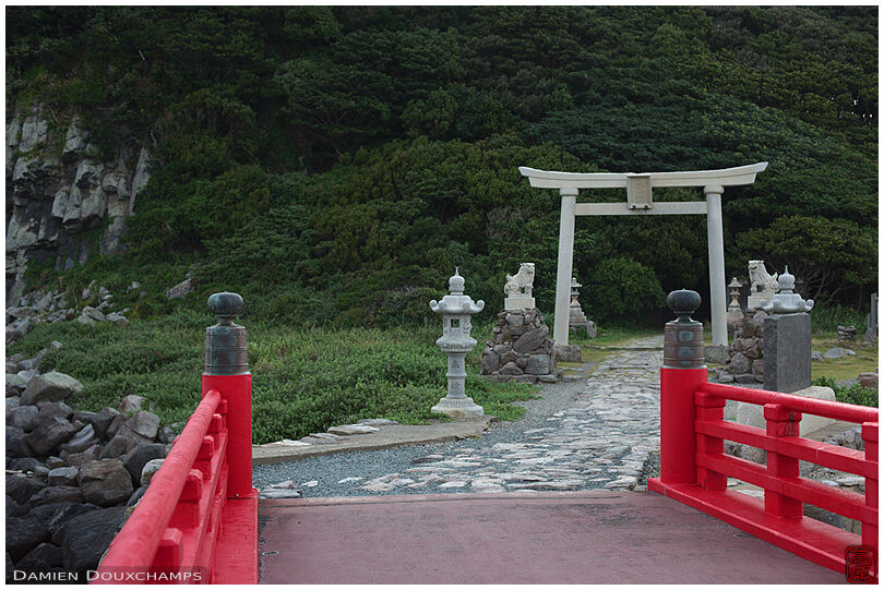 Large stone torii gate marking the entrance to the Oshima island in Fukui prefecture, Kyoto, japan