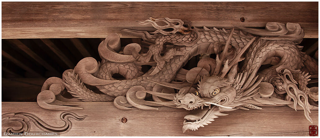 Wooden sculpture of a dragon on a temple building of Koyasan, Japan