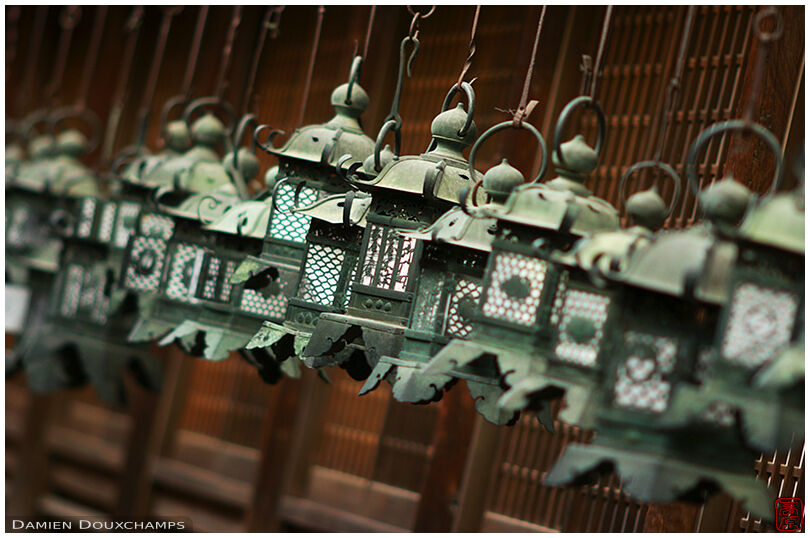 A row of metallic lanterns