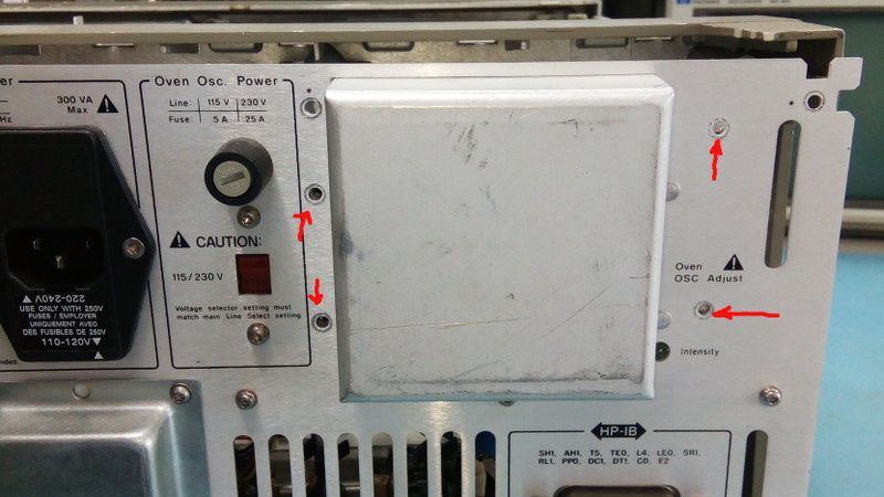 The Hewlett-Packard HP53310A back panel with oscillator mounting screws indicated in red.