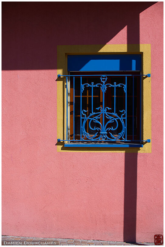 Pink wall, blue window