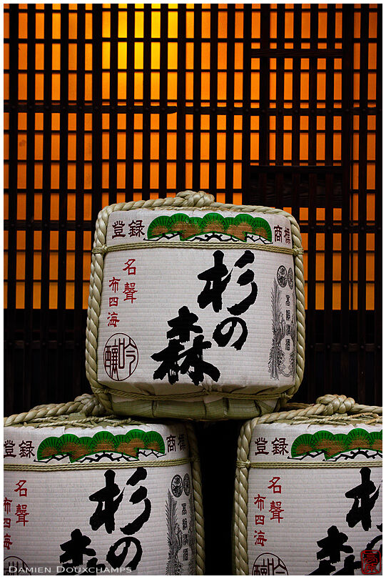 Sake barrels in front of a traditional Japanese facade