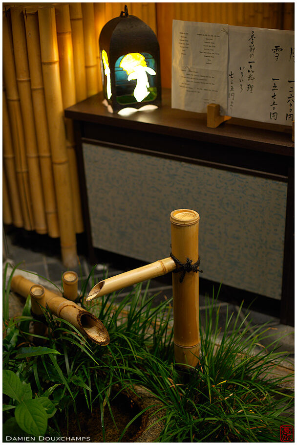 Shishi-odoshi at the entrance of a restaurant