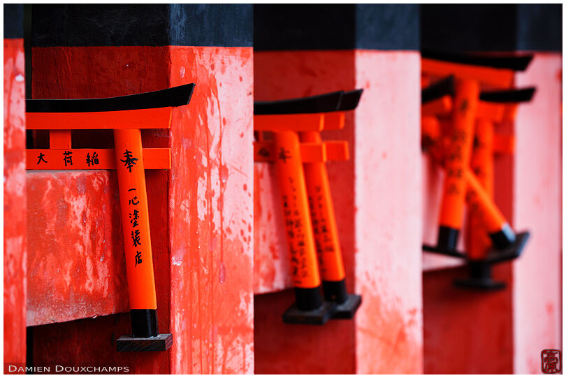 Small torii clinging to a fence (Fushimi Inari shrine 伏見稲荷大社)