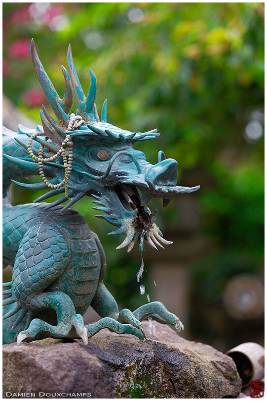 Dragon fountain with prayer beads