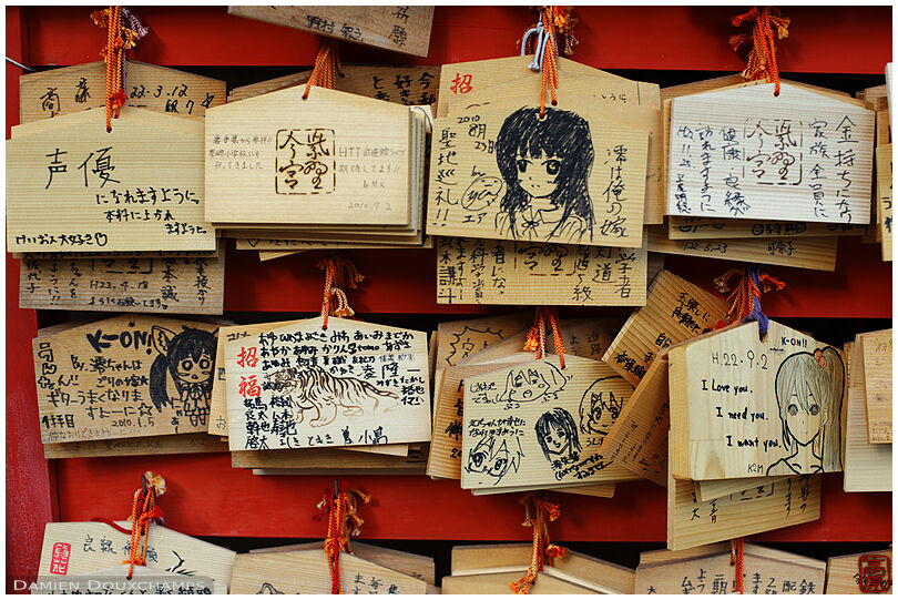 Ema tablet votive offerings with anime characters, Imamiya shrine, Kyoto, Japan