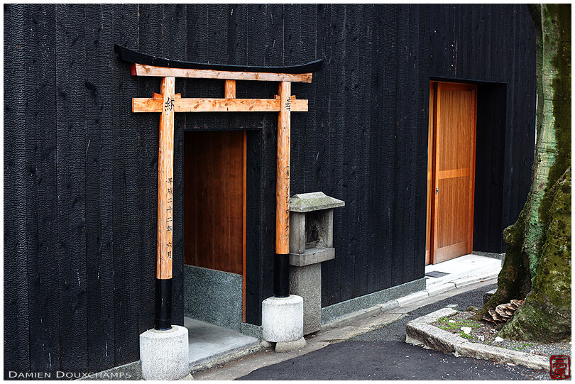 Old shrine embedded in private house, Kyoto, Japan