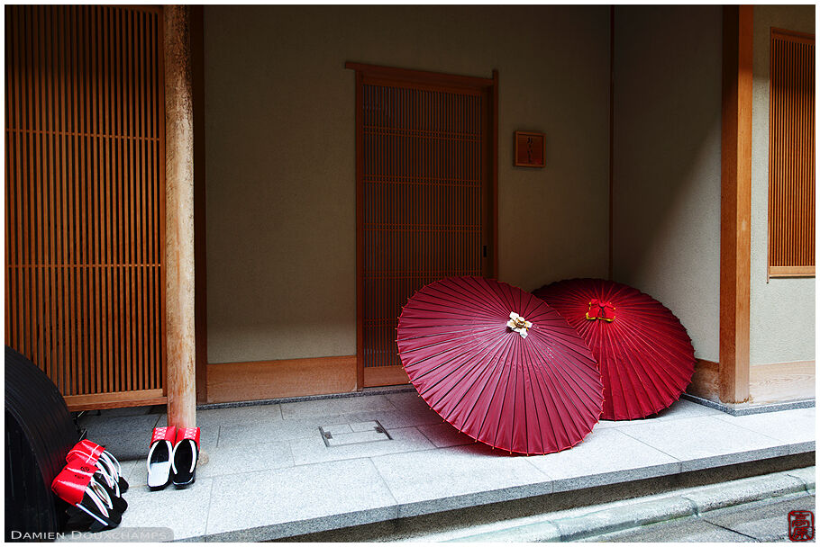 Traditional umbrellas and geisha footwear called geta in Gion