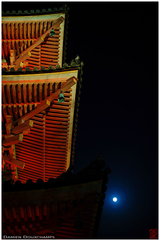 Temple roof lines at night with moon, Kiyomizudera