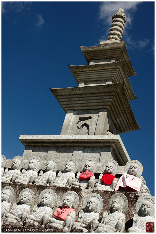 Small statues at the foot of a stone pagoda in Otokuni-dera