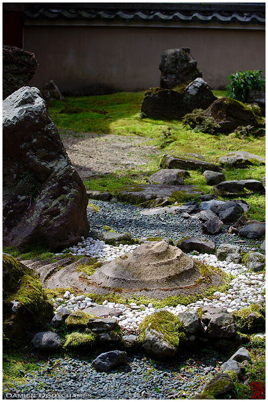 Small spiral shaped sand mound in the slightly random inner garden of Jurin-ji temple, Kyoto, Japan