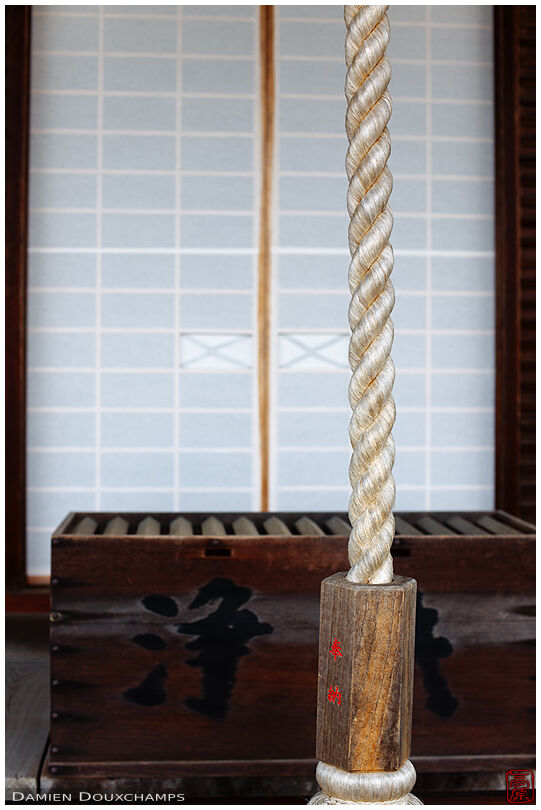 Bell rope and money box in Sanko-ji temple, Kyoto, Japan