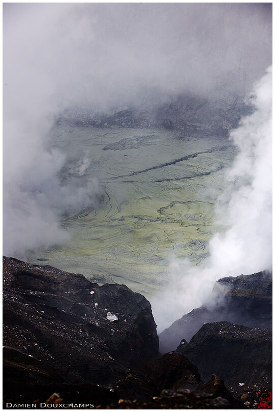 A glimpse of Mt. Aso crater through toxic sulfurous fumes