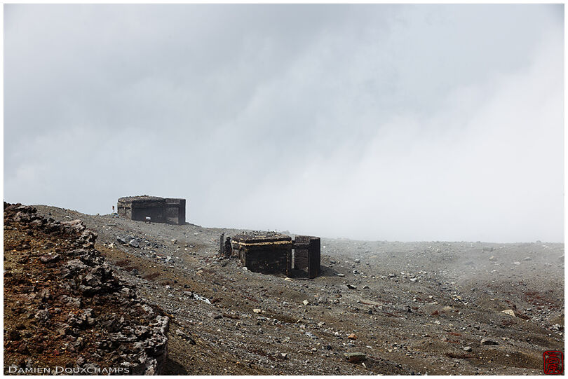 Old abandoned safety bunkers on the edge of Mt. Aso crater