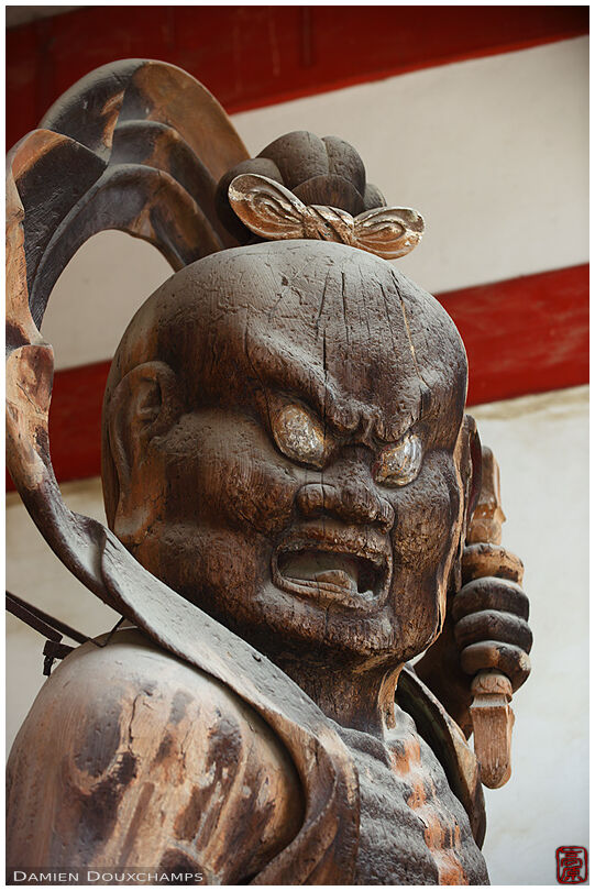 Wooden statue of deity guarding Daigo-ji temple gate