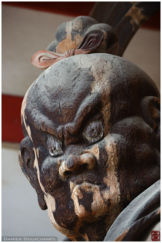 Wooden statue of deity guarding Daigo-ji temple gate