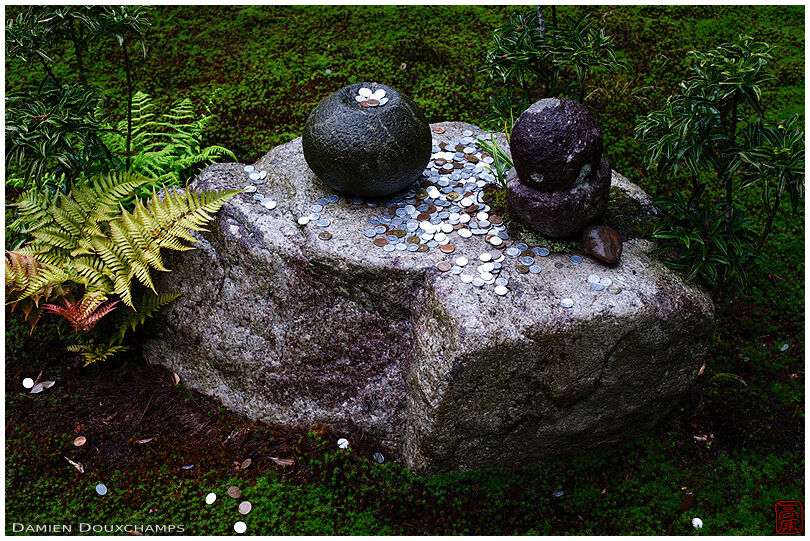 Stone with offerings in moss garden, Saisho-in