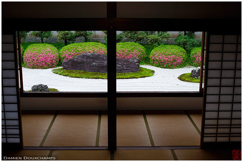 Bay window view on rock garden with blooming rhododendrons, Myoren-ji temple