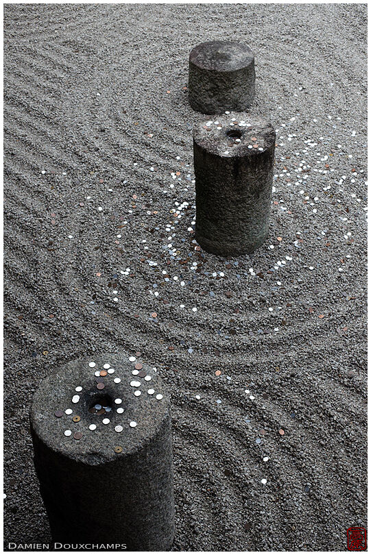 Rock garden with thrown coins in Tofuku-ji temple