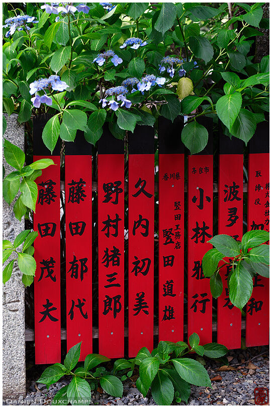 Red shrine fence with benefactor names