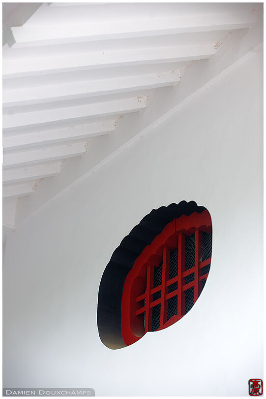 Red window on a temple granary