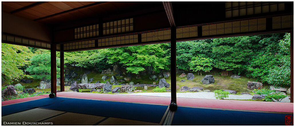 Green maple and dry landscape garden surrounding the main hall of Entoku-in temple, Kyoto, Japan